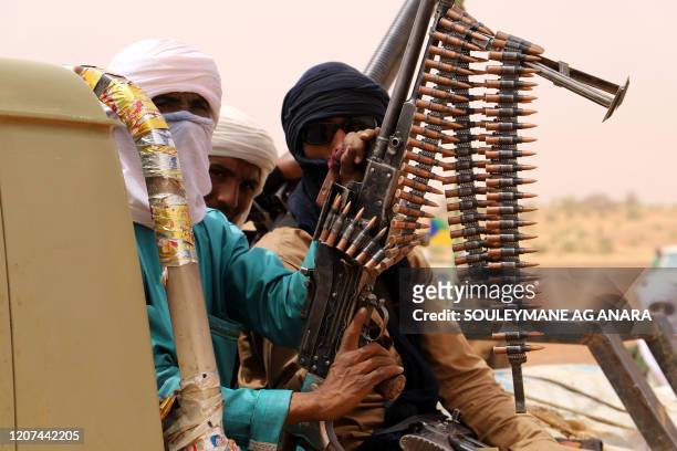 Armed militants from the Movement for the Salvation of Azawad , a Tuareg political and armed movement in the Azawad Region in Mali, gather in the...