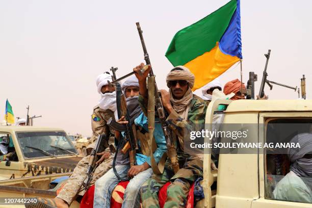 Armed militants from the Movement for the Salvation of Azawad , a Tuareg political and armed movement in the Azawad Region in Mali, gather in the...