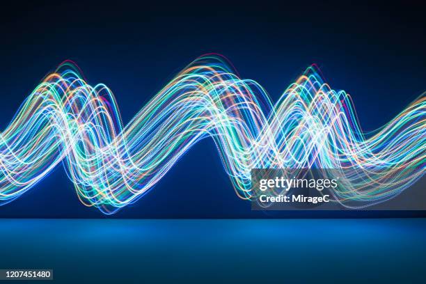 abstract flowing light trails - digital network pattern stock pictures, royalty-free photos & images