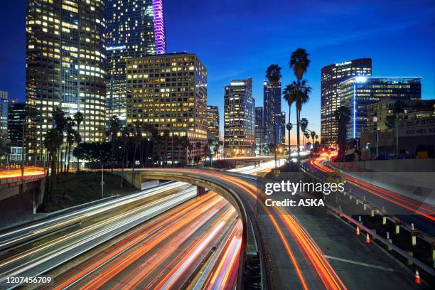 downtown los angeles traffic at sunset - city of los angeles night stock pictures, royalty-free photos & images