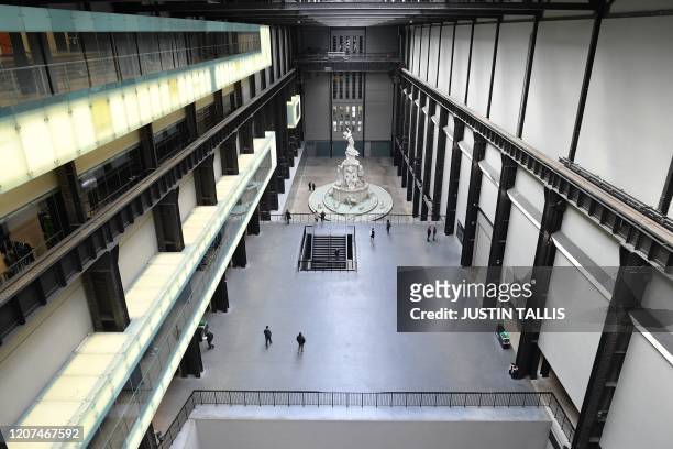 Picture shows a near-empty Turbine Hall at the Tate Modern in London on March 17, 2020 after the UK government announced stricter measures and social...