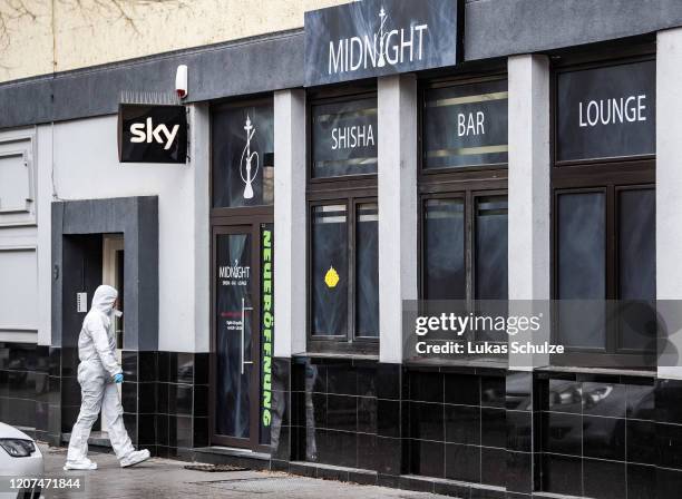 Forensic officer at the scene outside the Midnight hookah bar, one of two bars that were targeted by a gunman last night, on February 20, 2020 in...