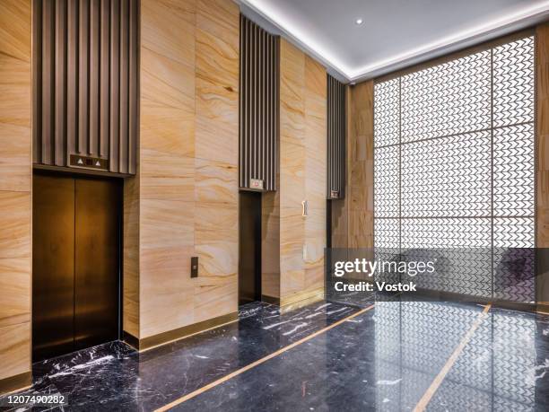 lobby in front of the hotel elevators - hotel hallway stock pictures, royalty-free photos & images
