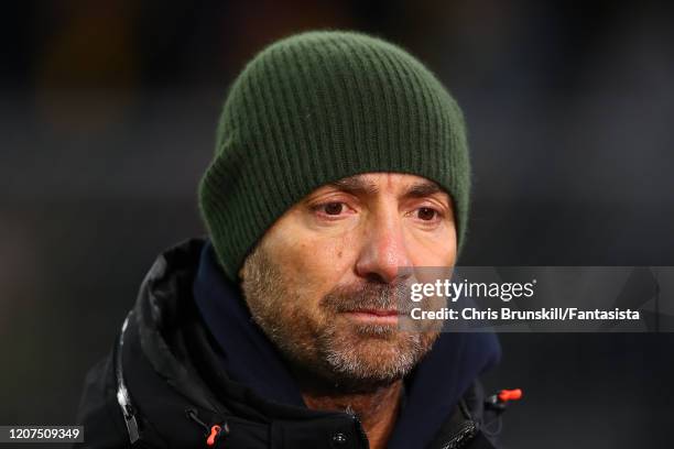 Christophe Dugarry looks on during the UEFA Champions League round of 16 first leg match between Borussia Dortmund and Paris Saint-Germain at Signal...