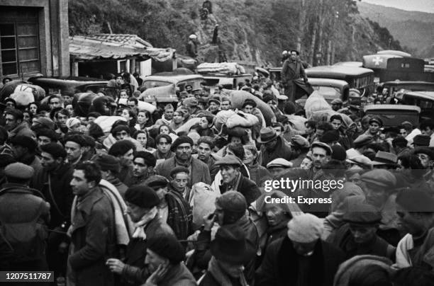 Spanish Republican refugees during the Retirada attempting to cross the Spanish-French border at Le Perthus, France, 8th February 1939. .