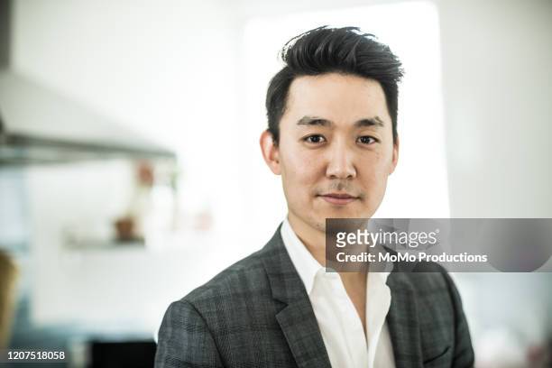 portrait of businessman at home - asia stock-fotos und bilder