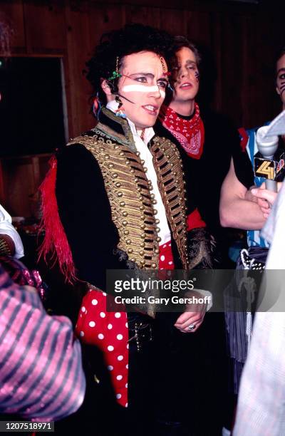 Members of English New Wave group Adam and the Ants are interviewed by an unidentified journalist backstage at the Palladium, New York, New York,...