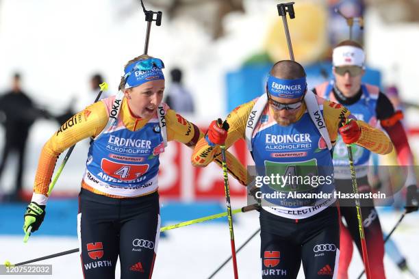 Franziska Preuss of Germany hands over to her team mate Erik Lesser during the Single Mixed Relay at the IBU World Championships Biathlon...