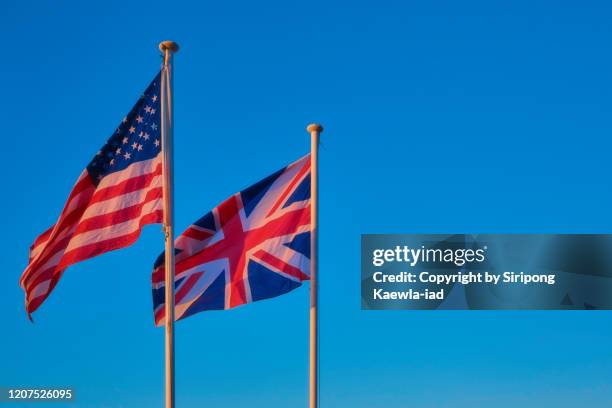 the national flag of the united states of america and the united kingdom. - british and eu flag ストックフォトと画像