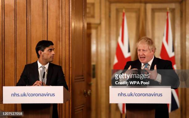 Britain's Chancellor Rishi Sunak, and British Prime Minister Boris Johnson give a press conference about the ongoing situation with the coronavirus...