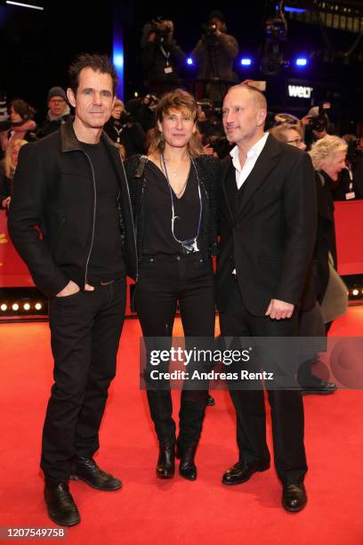 Tom Tykwer, Marie Steinmann and Benno Fuermann arrive for the opening ceremony and "My Salinger Year" premiere during the 70th Berlinale...