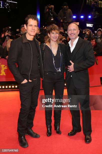 Tom Tykwer, Marie Steinmann and Benno Fuermann arrive for the opening ceremony and "My Salinger Year" premiere during the 70th Berlinale...