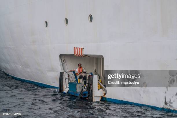 a crew spends the day waiting people for the side of the cruise shi - cruise ship staff stock pictures, royalty-free photos & images
