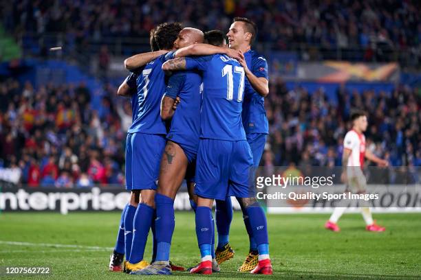 Deyverson of Getafe CF celebrates after scoring his team's first goal and gets hit by a lighter during the UEFA Europa League round of 32 first leg...