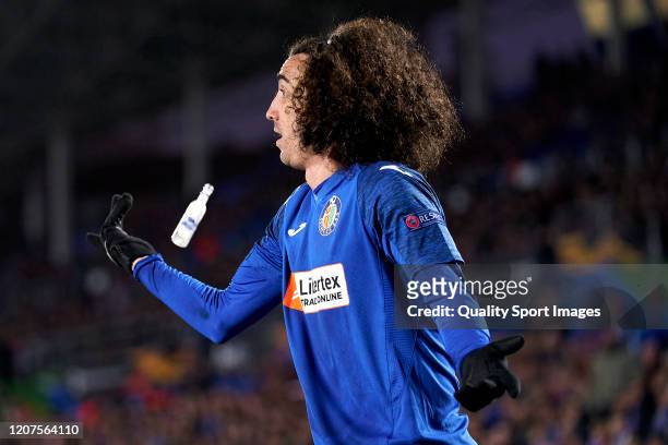 Cucurella of Getafe CF reacts as he is almost hit by a small bottle during the UEFA Europa League round of 32 first leg match between Getafe CF and...