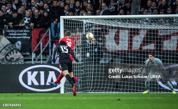 Daichi Kamada of Frankfurt challenges for the ball with Maximilian Wöber of Salzburg and scores his team's third goal against Goalkeeper Cican...