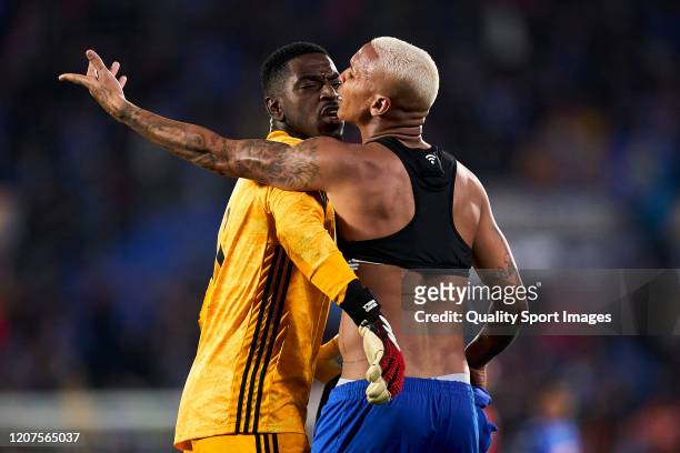 Deyverson of Getafe CF argues with Bruno Varela of AFC Ajax during the UEFA Europa League round of 32 first leg match between Getafe CF and AFC Ajax...