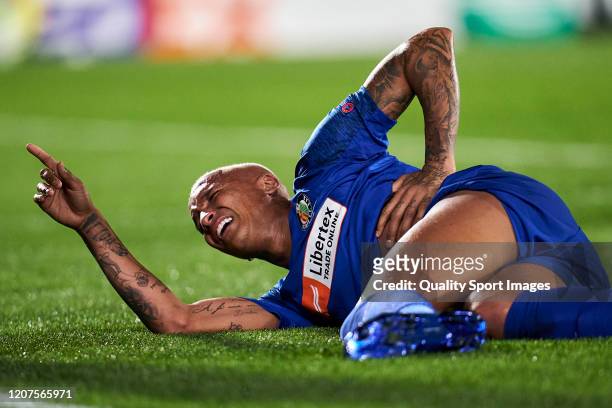 Deyverson of Getafe CF reacts on the floor after being hit by a lighter during the UEFA Europa League round of 32 first leg match between Getafe CF...