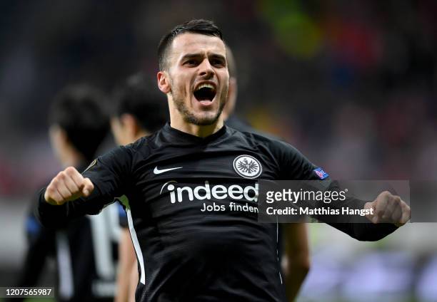 Filip Kostic of Eintracht Frankfurt celebrates after socring his teams fourth goal during the UEFA Europa League round of 32 first leg match between...