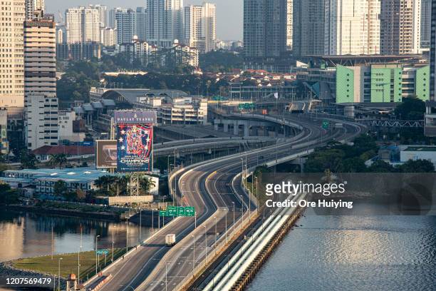 General view of the Woodlands Causeway on March 18, 2020 in Singapore. The land link between Singapore and Johor Bahru, Malaysia is empty of its...
