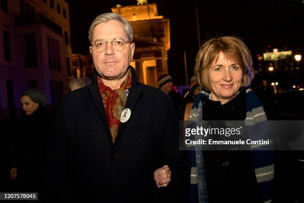 German politician of the Christian Democratic Union Norbert Roettgen and his wife Ebba Herfs-Roettgen attend a vigil at the Brandenburg Gate to...