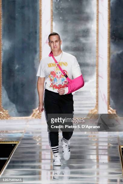 Fashion designer Jeremy Scott acknowledges the applause of the audience during the Moschino fashion show as part of Milan Fashion Week Fall/Winter...