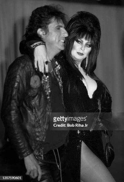 Alice Cooper and Elvira backstage during the 26th Annual Grammy Awards at the Shrine Auditorium, February 28, 1984 in Los Angeles, California.