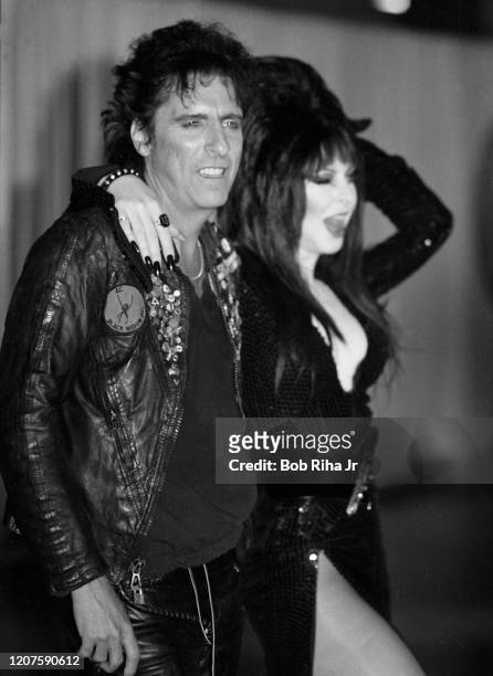 Alice Cooper and Elvira backstage during the 26th Annual Grammy Awards at the Shrine Auditorium, February 28, 1984 in Los Angeles, California.