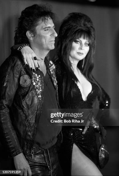 Alice Cooper and Elvira backstage during the 26th Annual Grammy Awards at the Shrine Auditorium, February 28, 1984 in Los Angeles, California.