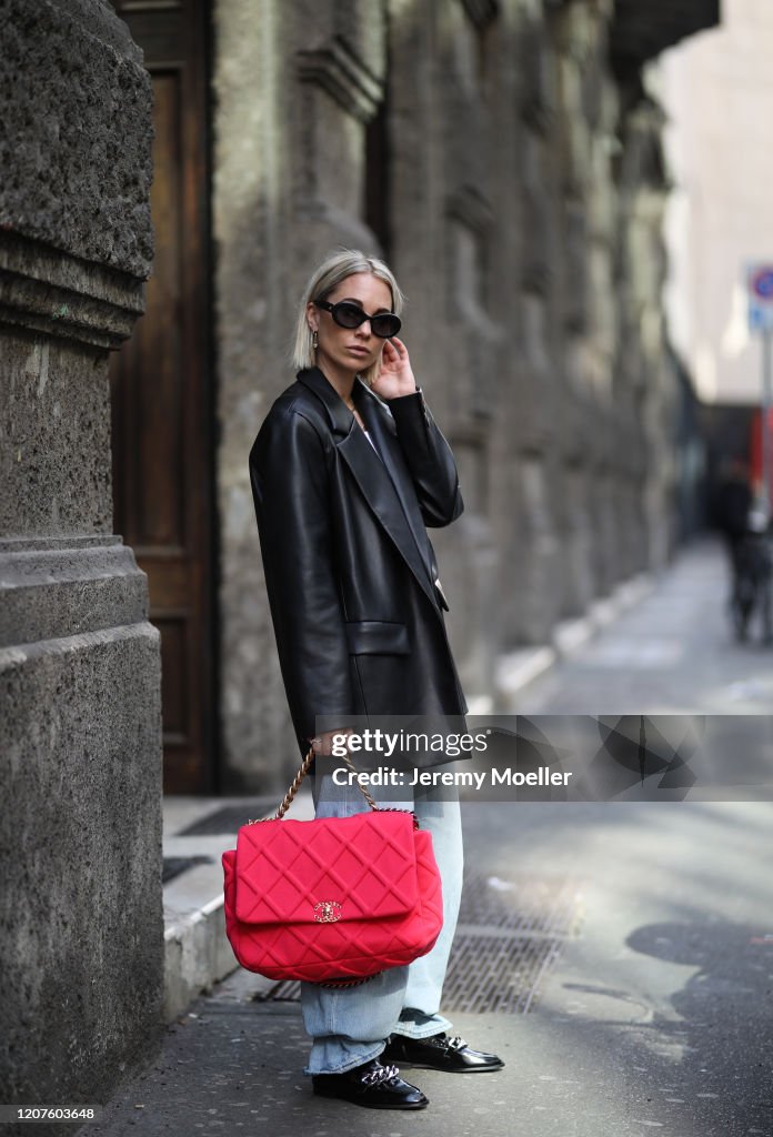 Karin Teigl wearing a Chanel bag and shades and Zara loafer during