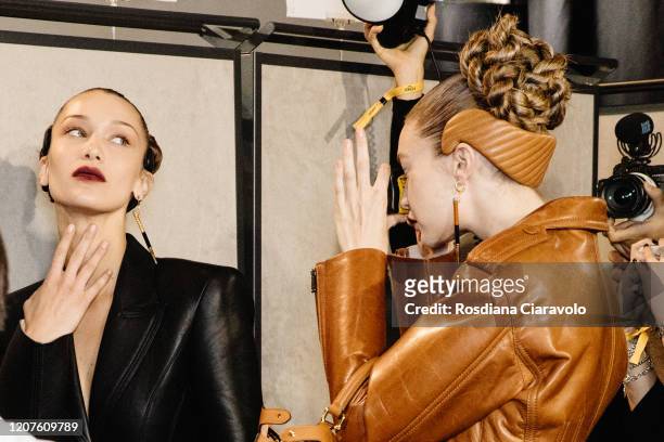 Bella Hadid pose for Gigi Hadid single-use camera during backstage at the Fendi fashion show on February 20, 2020 in Milan, Italy.