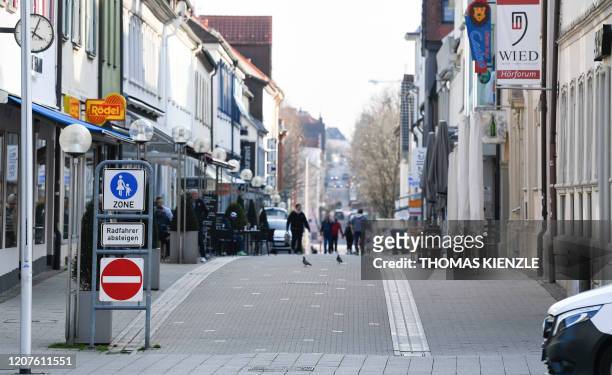 People walk down a shopping street in Ludwigsburg, southern Germany, on March 18, 2020 despite the spread the new corounavirus COVID-19. - German...