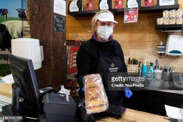 Bakery employee performs her work in the city of Santander, Spain on March 18, 2020 complying with the safety and hygiene protocols for the...