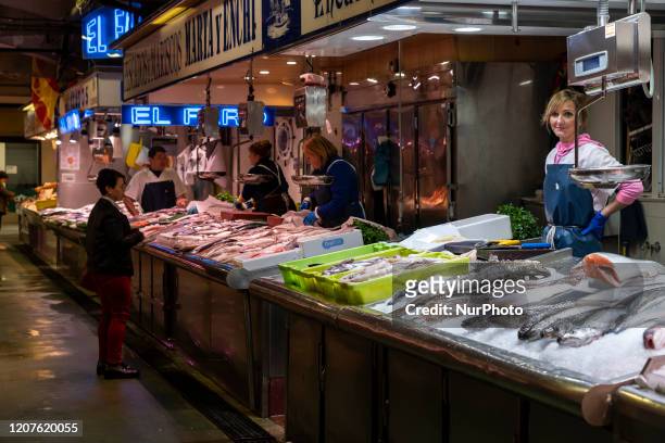 Few people are seen shopping in the fishmongers of the Central Market in Santander, Spain on March 18, 2020 on the fourth day of the Coronavirus...