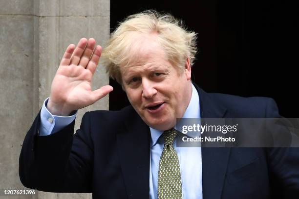 Boris Johnson leaves 10 Downing Street in central London on March 18 to take part in Prime Minister's Questions at the House of Commons. The British...