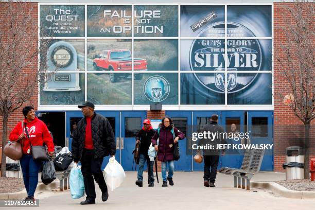 Workers leave FCA Chrysler Warren Truck Assembly after the Detroit three automakers have agreed to UAW demands to shut down all North America plants...