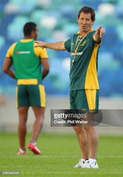 Wallabies coach Robbie Dean instructs his players during an Australian Wallabies training session at the Moses Mabhida Stadium on August 9, 2011 in...