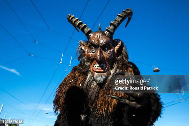 Man in a costume performs during the carnival parade on February 20, 2020 in Lucerne, Switzerland. Lucerne Carnival will be held in Lucerne February...