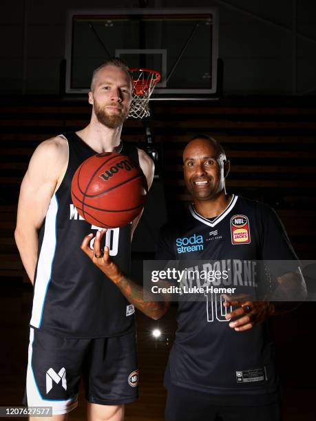 David Barlow of Melbourne United and former Socceroo Archie Thompson pose for a photo during a Melbourne United NBL media opportunity at the...