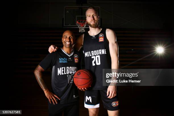 Former Socceroo Archie Thompson and David Barlow of Melbourne United pose for a photo during a Melbourne United NBL media opportunity at the...