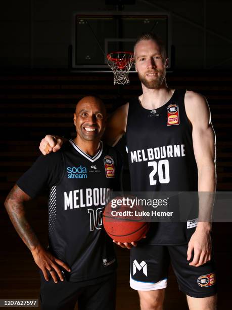 Former Socceroo Archie Thompson and David Barlow of Melbourne United pose for a photo during a Melbourne United NBL media opportunity at the...