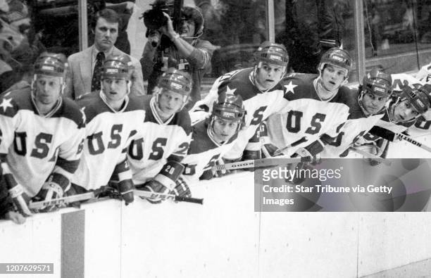 Lake Placid, NY. February 22: United States coach Herb Books and players look to the action on the ice during a medal round game vs. The Soviet Union...