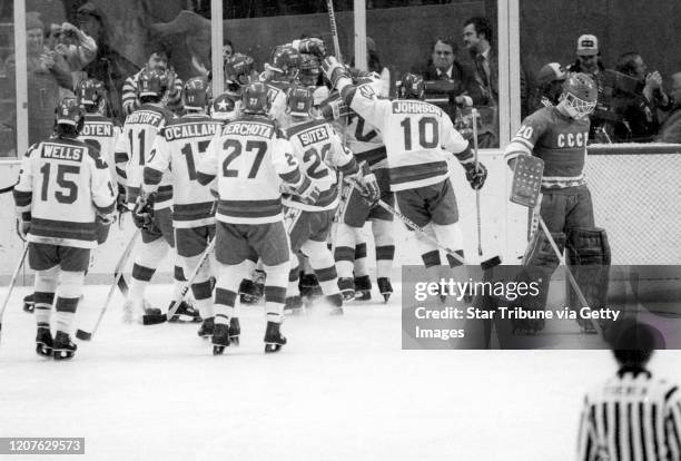 Lake Placid, NY. February 22: United States players celebrated a goal behind Soviet Union goalie Vladislav Tretiak during a medal round game at the...