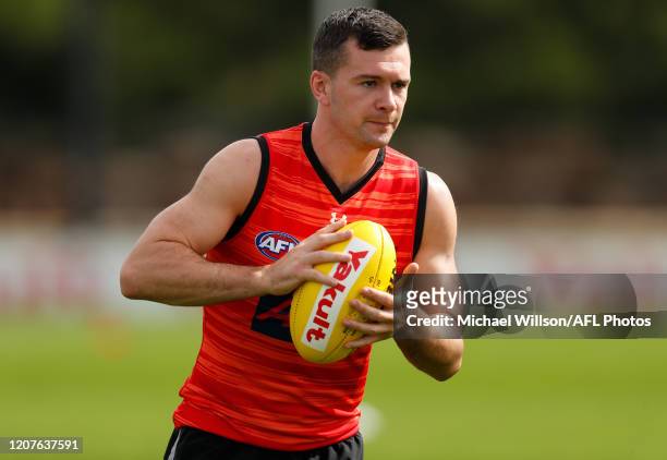 Conor McKenna of the Bombers in action during the Essendon Bombers training session at The Hangar on March 19, 2020 in Melbourne, Australia.