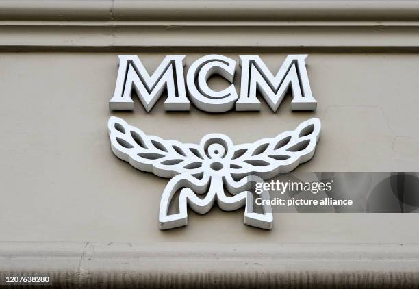 March 2020, Berlin: The logo of the label MCM, known for luxury handbags, backpacks, belts. Photo: Jens Kalaene/dpa-Zentralbild/ZB