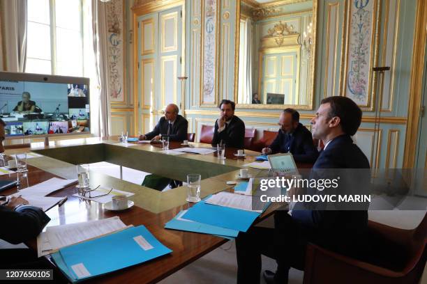 French president Emmanuel Macron , Prime minister Edouard Philippe Prime Minister's chief of staff Benoit Ribadeau-Dumas and other advisers take part...