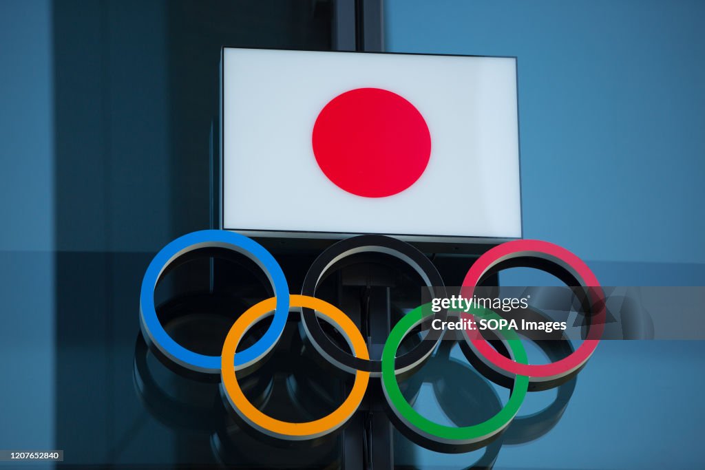 Japanese National Flag over the Olympic Rings symbol is seen...