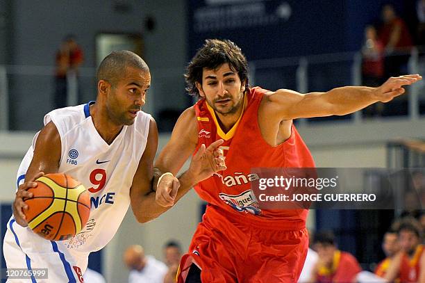 Spain's player Ricky Rubio vies for the ball with French national team's player Tony Parker during a friendly basket ball game in preparation for...