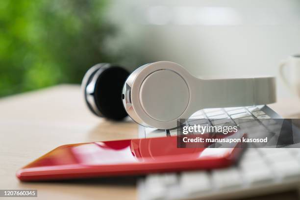 white headphones and laptop. - red headphones stock pictures, royalty-free photos & images