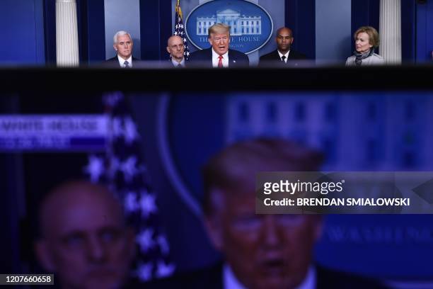 President Donald Trump , with Vice President Mike Pence, FDA Commissioner Stephen Hahn, US Surgeon General, Dr. Jerome Adams, and White House...
